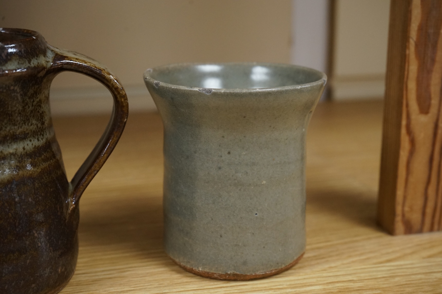 A group of Leach St. Ives pottery jugs and a pot and three other studio items of studio ceramics, some with impressed marks, largest 25cm high